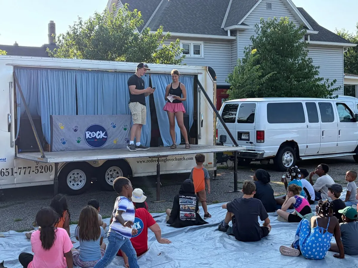 Students leading an outdoor neighborhood kids program on an Enhance mission trip