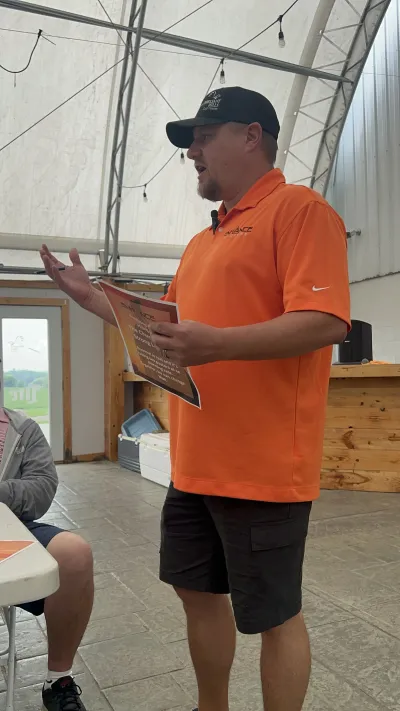 Matt speaking at the golf event